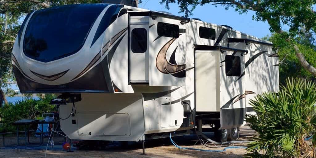 An RV parked at a campground, prepared for a road trip out of the Kansas City metro.